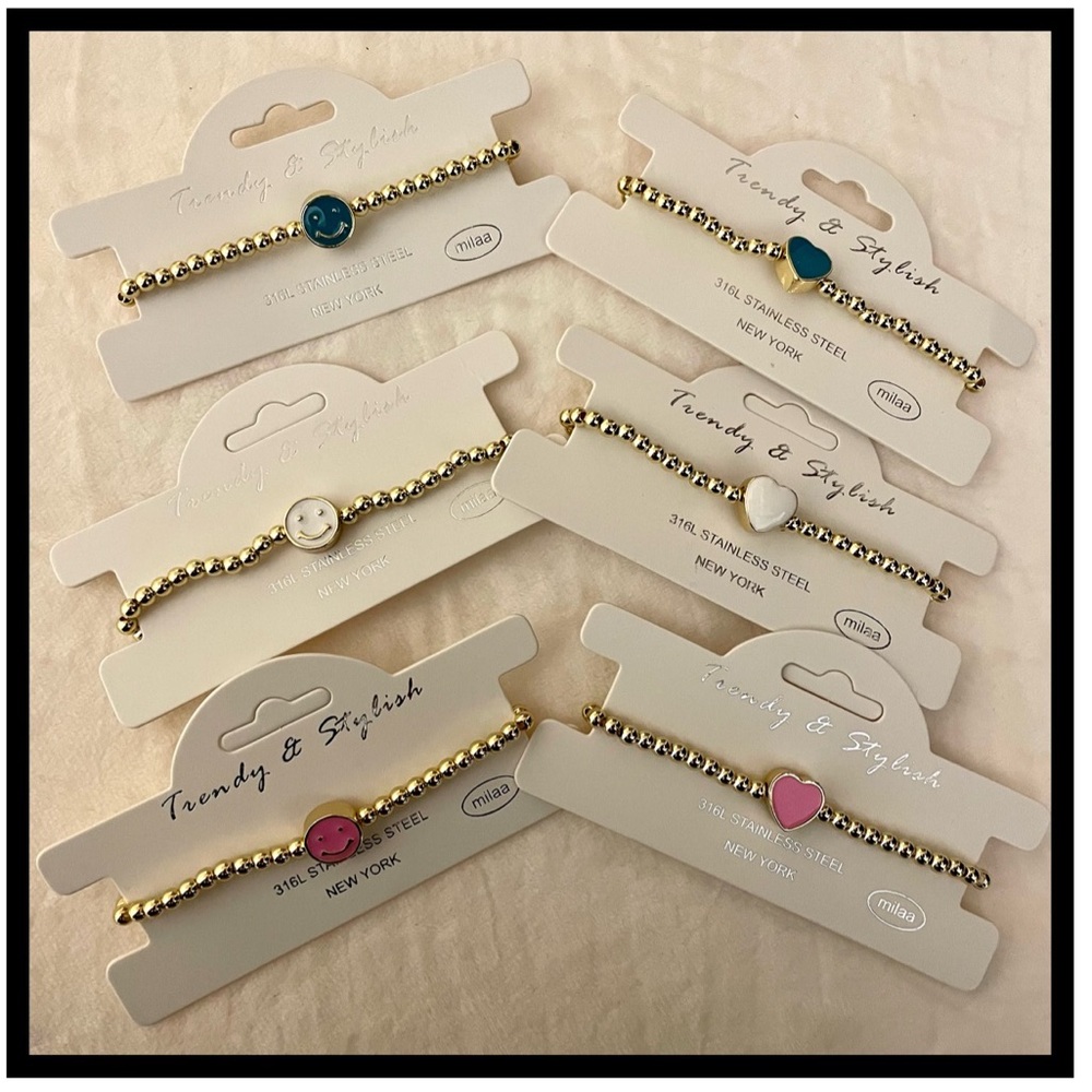 multicolored smiley face and heart bracelets each pair $7